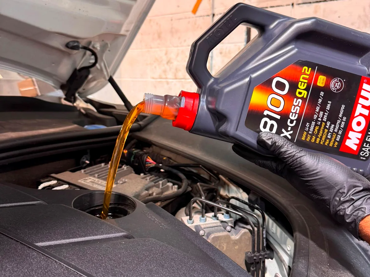 Motul oil being poured during a Porsche oil service